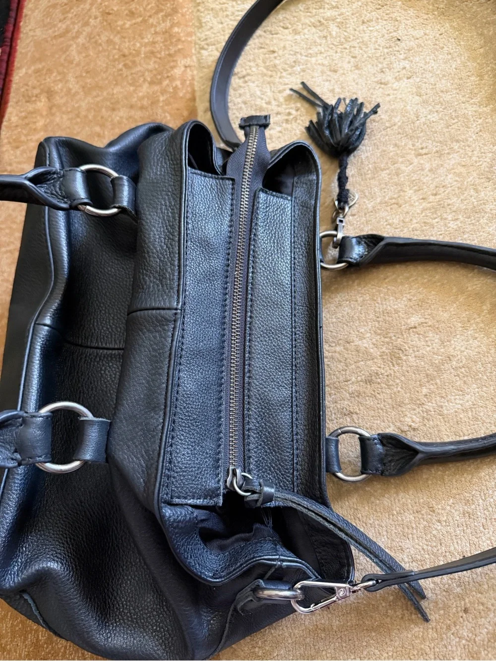 The Sak Black Leather Tote Bag with Tassel Accent